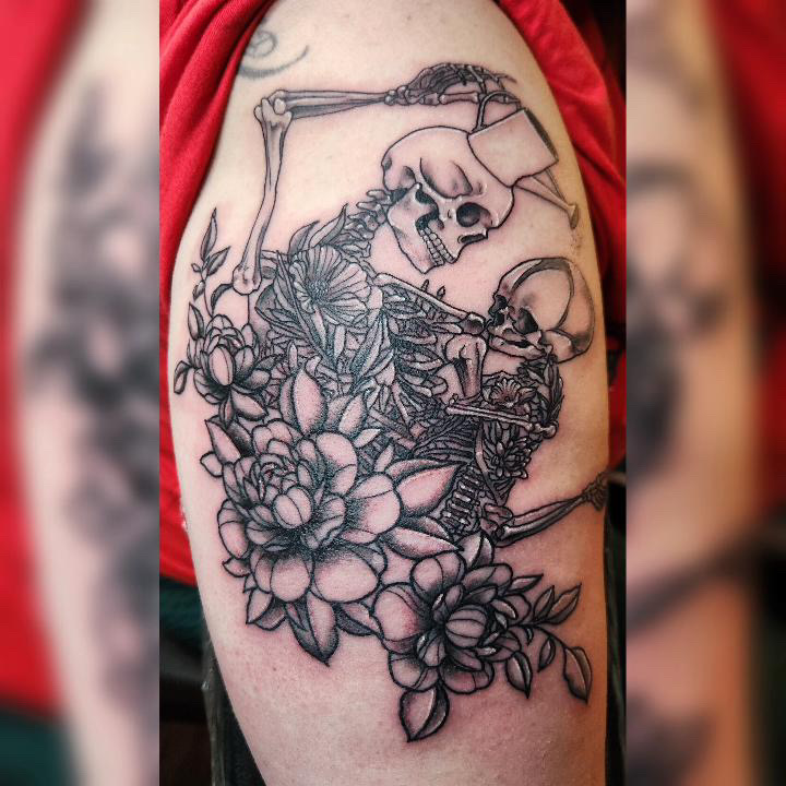 Fine line black and grey tattoo of a mother and baby skeleton with a watering can and flowers.